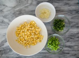 These baked shrimp corn cakes are tasty appetizers which require a handful of simple ingredients and easy cooking steps. They are crispy, and the baking method makes them guilt-free.