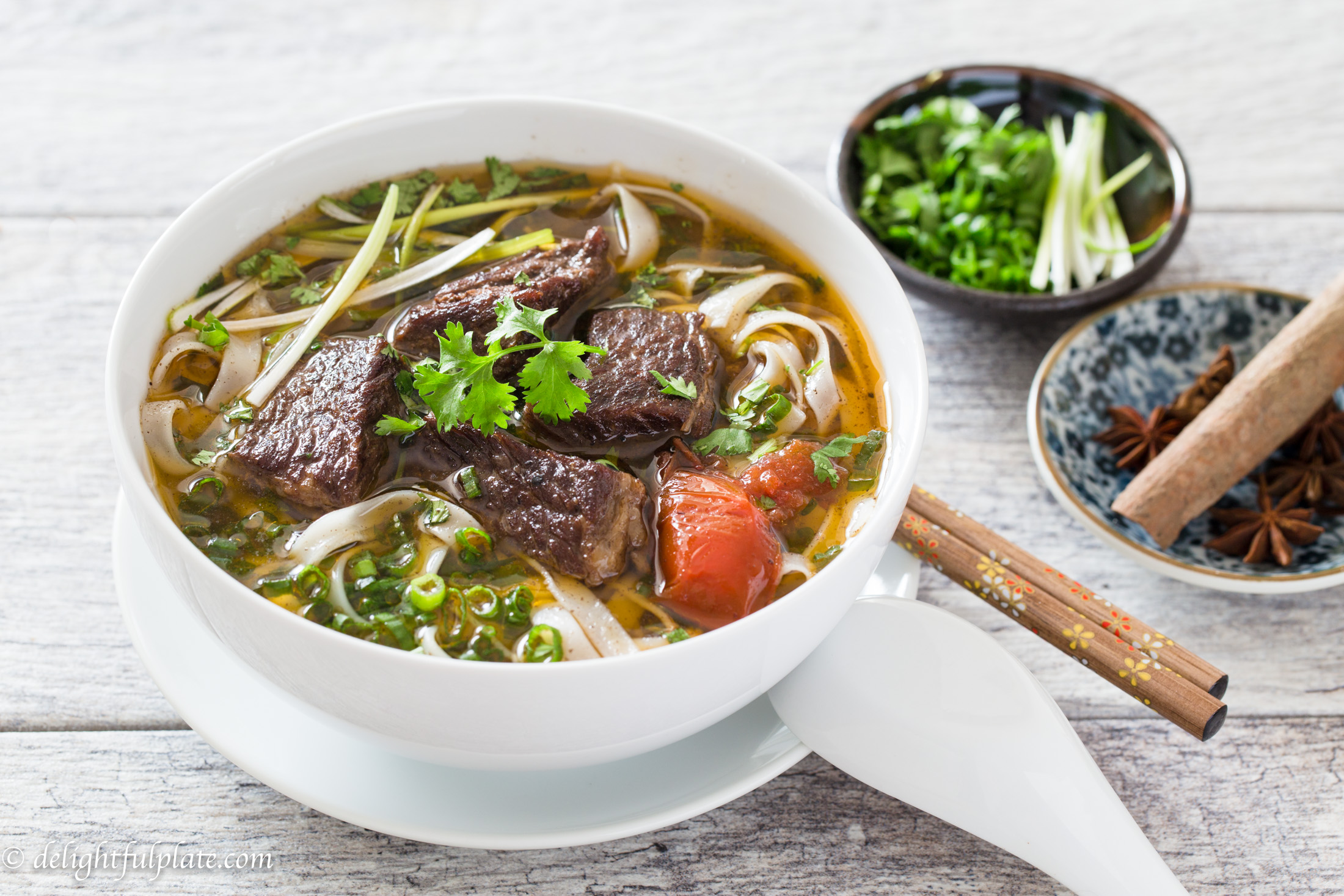 A bowl of hearty and comforting Vietnamese beef stew pho noodle soup