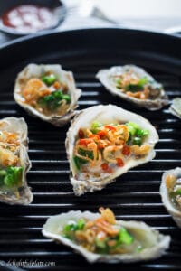 Vietnamese-style grilled oysters are tasty and flavorful with scallions and crispy fried shallots. It is a quick, easy and healthy appetizer