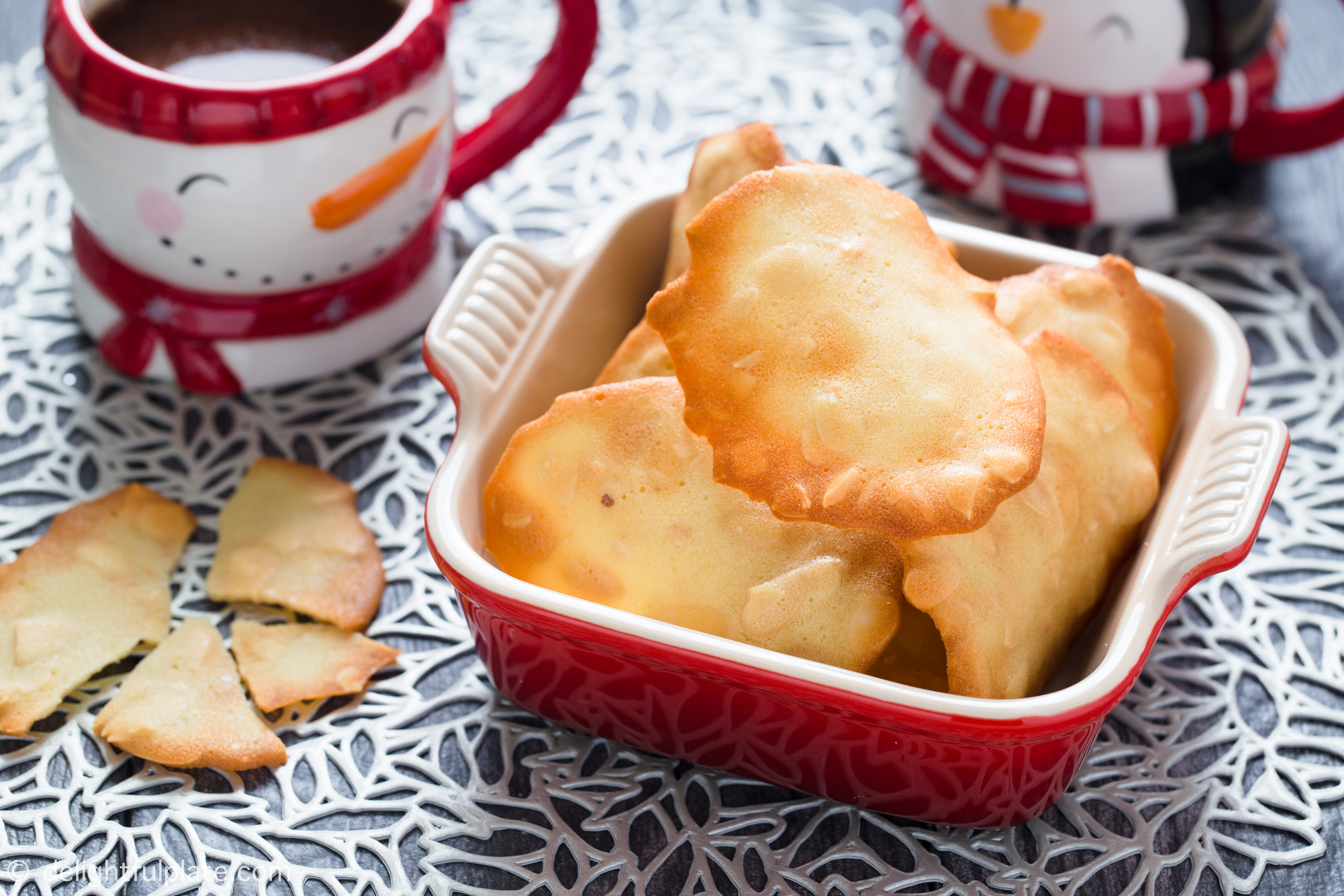 a plate of almond tuile cookies