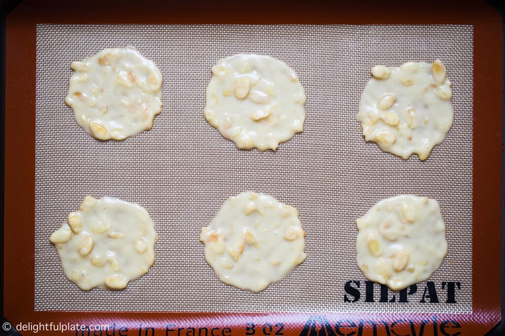 tuile batter spread on a baking mat