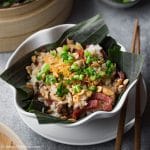 A delicious bowl of Vietnamese chicken sticky rice with Chinese sausage and shiitake mushrooms.