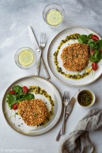 Crispy baked pork schnitzel that doesn't need to be deep-fried. It is healthy and much less messy to make. Serve it with a caper garlic butter sauce to increase the deliciousness.