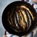 Sardines braised with tomatoes and green tea in a pot.