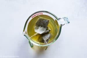 Brew green tea for passion fruit iced tea
