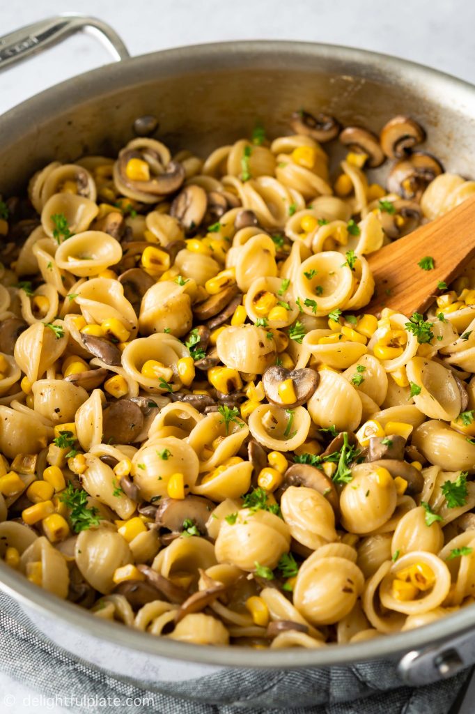 a pan of mushroom corn pasta