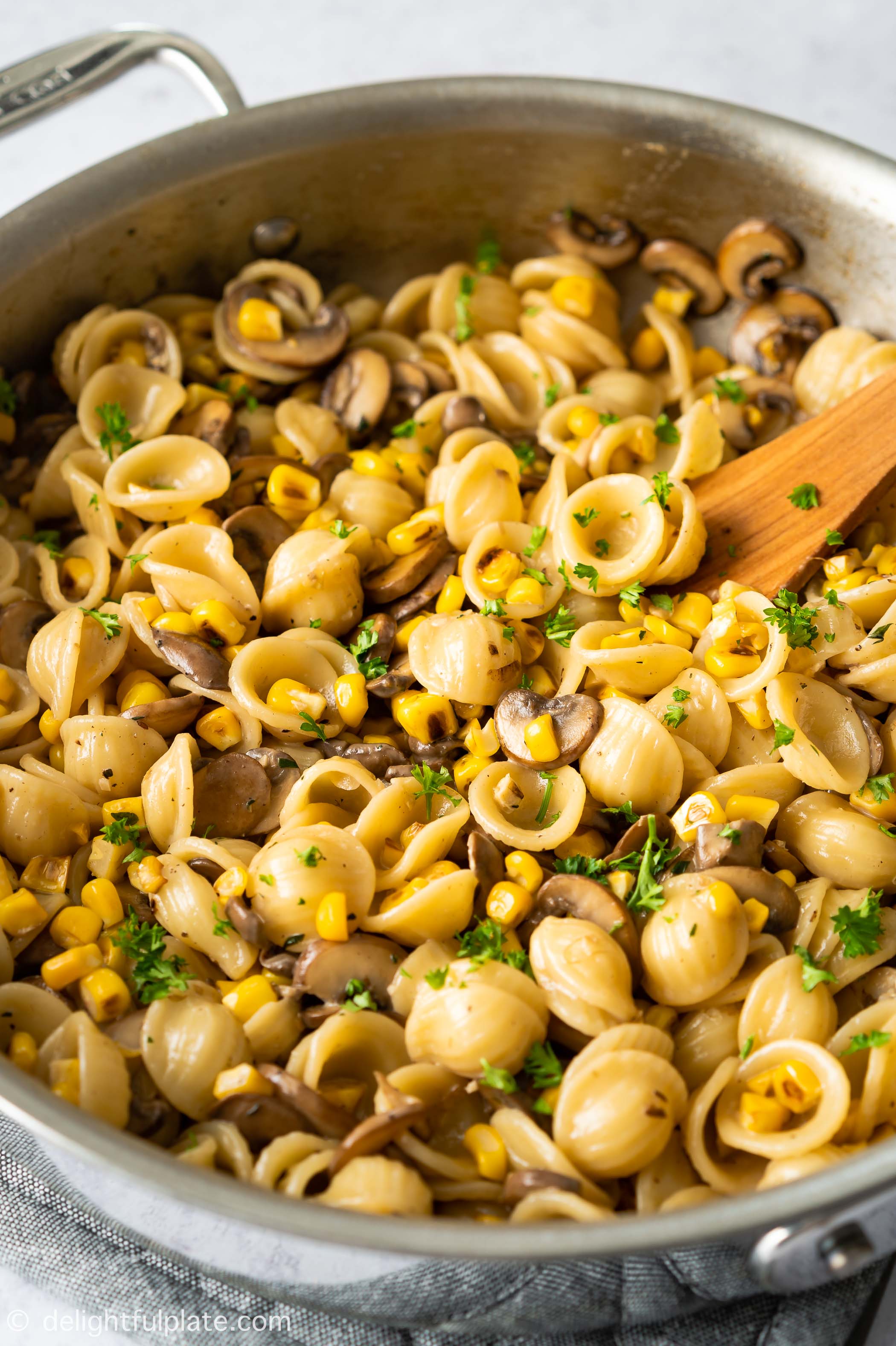 a pan of mushroom sweet corn pasta