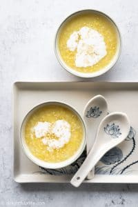 Vietnamese Mung Bean Pudding (che do xanh), a sweet dessert soup featuring split mung bean. It can be served with sticky rice and coconut milk.