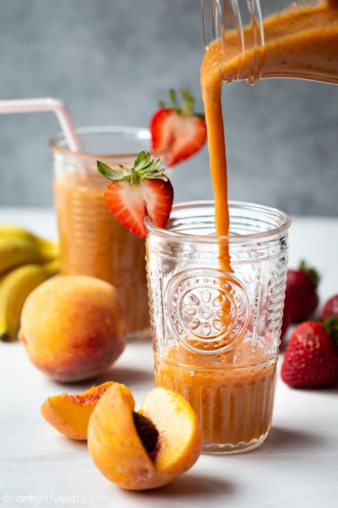 Thick and creamy strawberry peach smoothie made with strawberry, peach, banana, pineapple, mango, mint and parsley. A very refreshing, tasty and healthy breakfast smoothie.