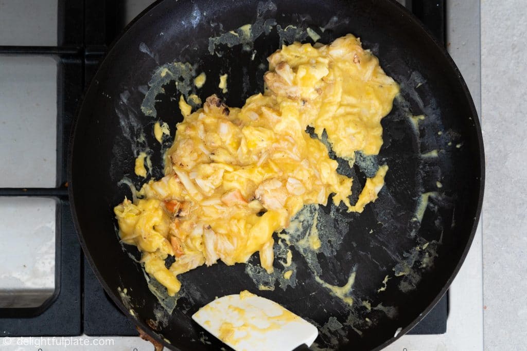 Crab Scrambled Eggs Step 4: flip and slightly break up the eggs.