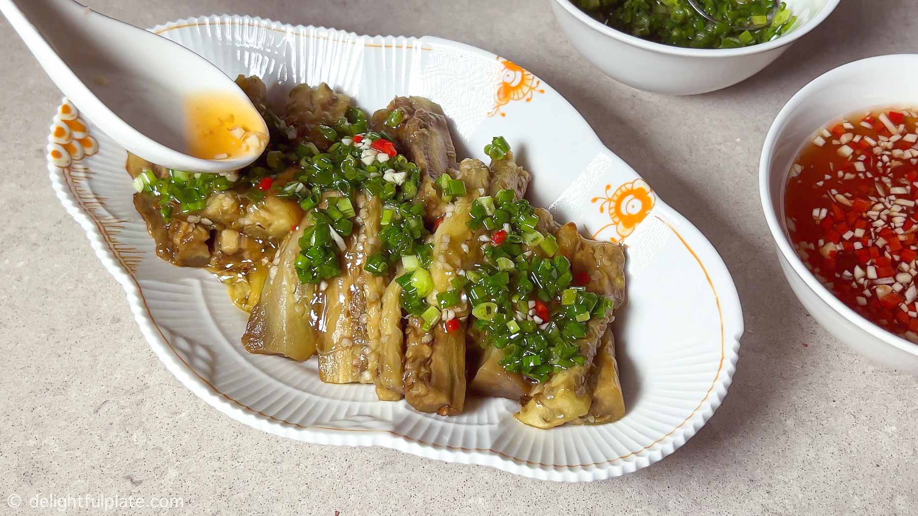 drizzle fish sauce dressing over grilled eggplants