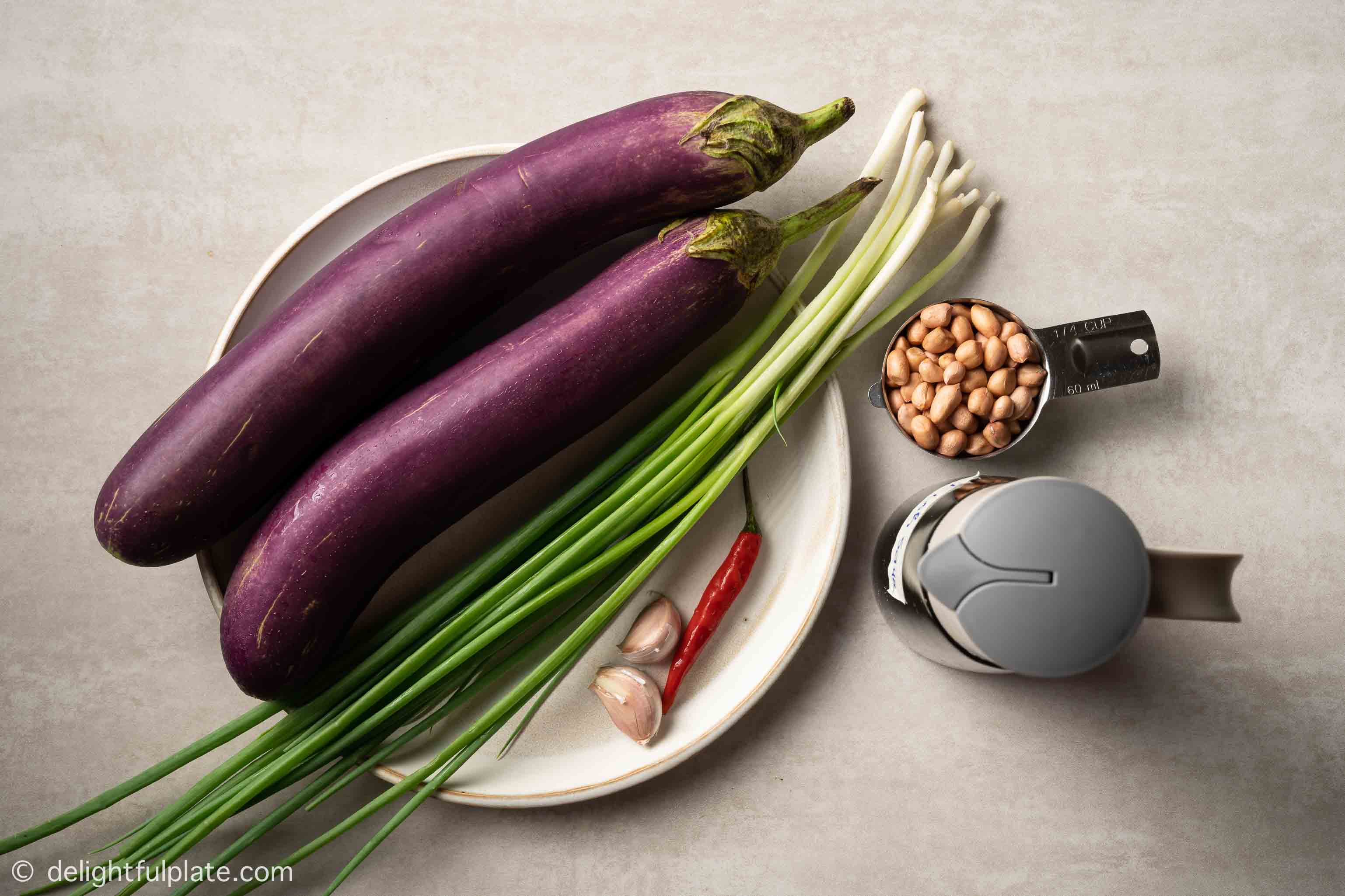 plates with ingredients for Vietnamese grilled eggplants