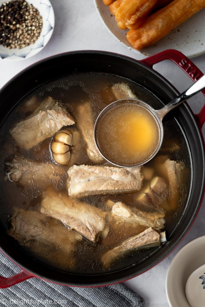 A pot of bak kut teh (Singapore-style pork bone tea soup with white pepper).