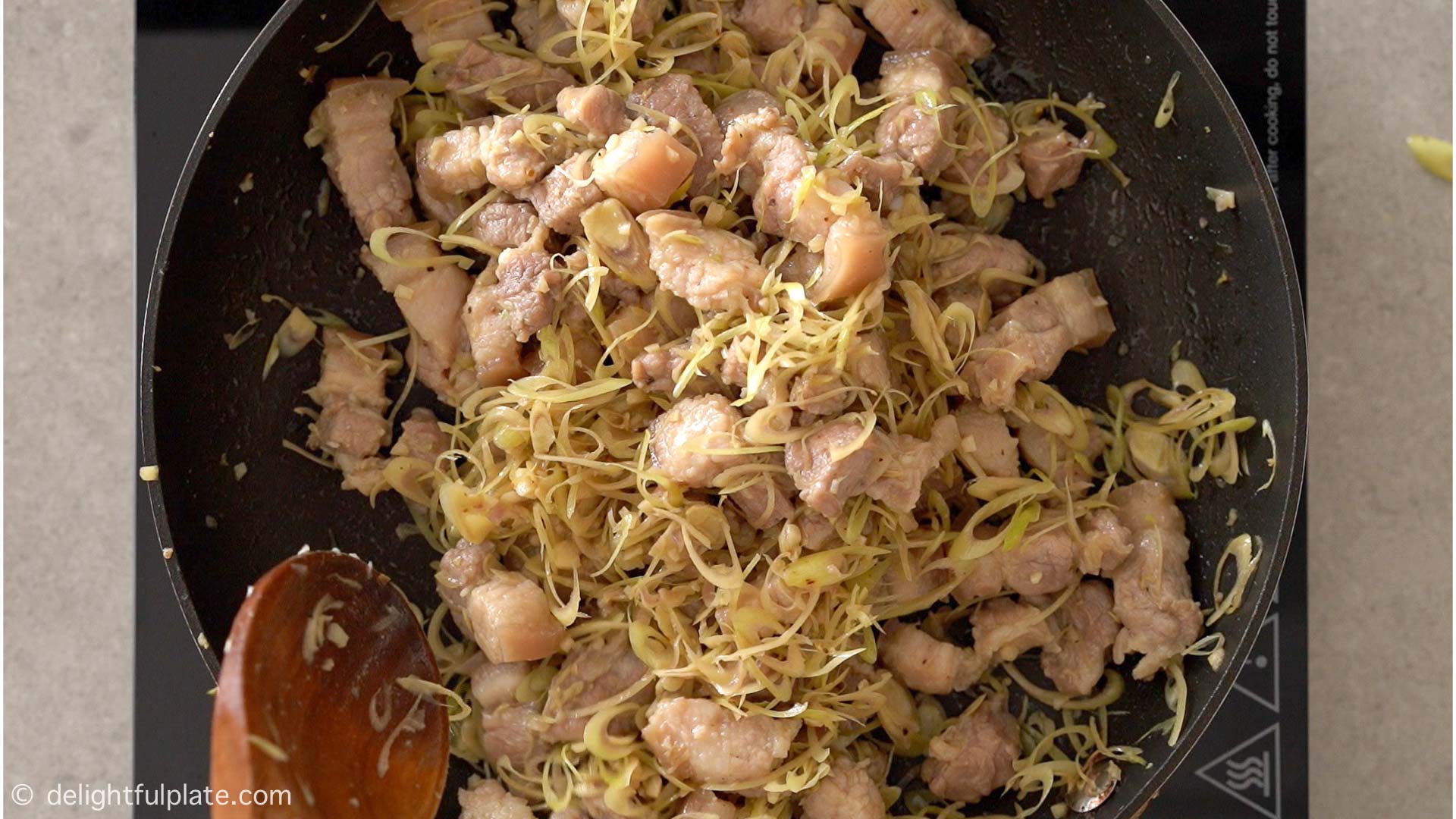 cook the pork belly with lemongrass in a pan