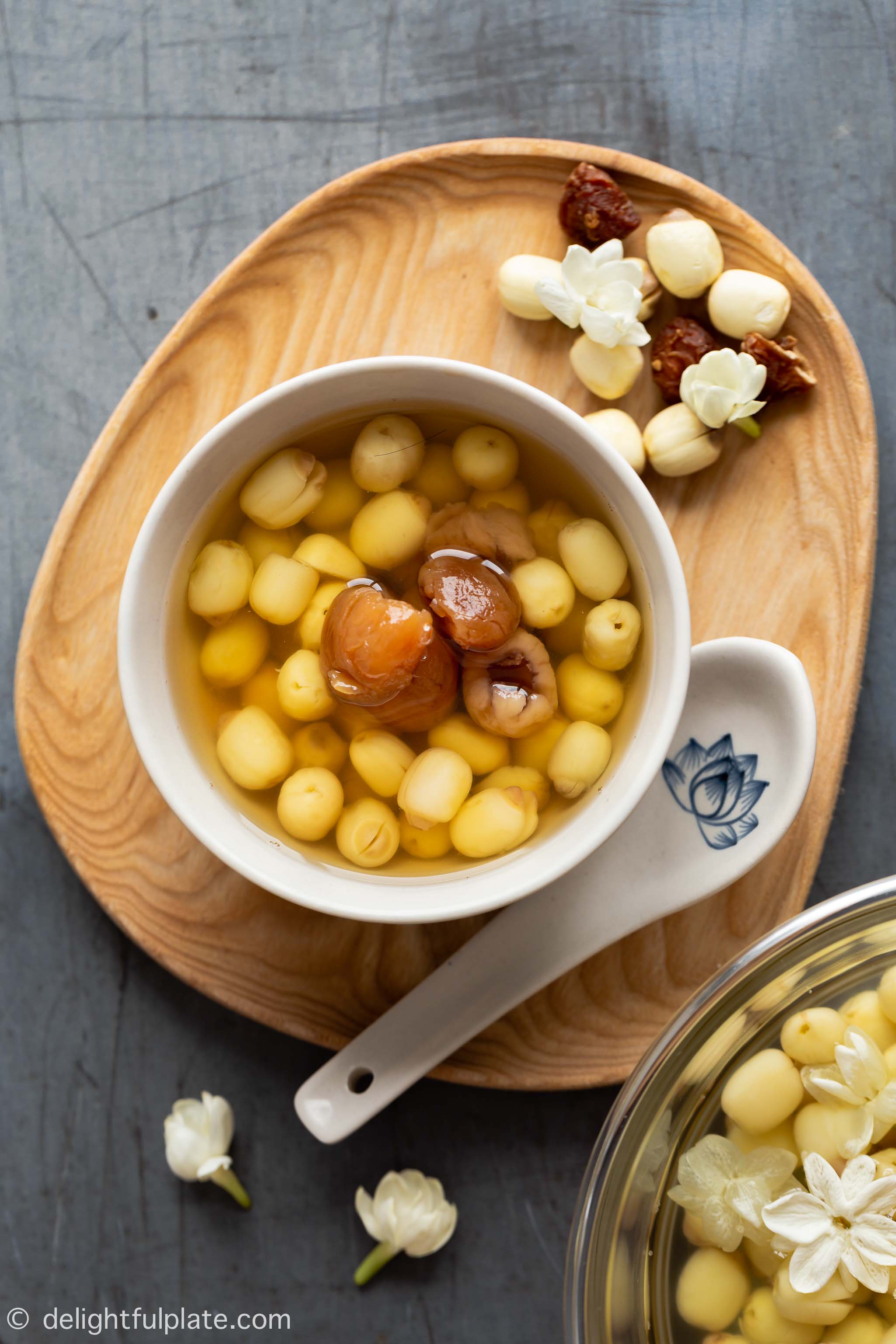 a serving bowl with lotus seed soup and longan