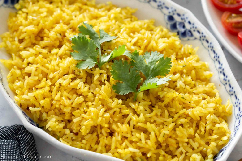 a serving plate with garlic fried rice, serve with soy sauce on the side.
