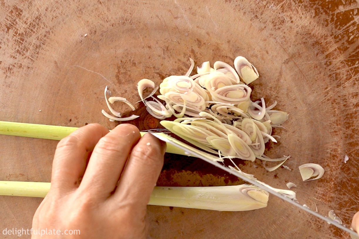 slicing lemongrass very thinly on a bias