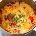 A pot of Vietnamese tomato egg drop soup.