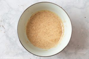 a bowl with sesame dressing that has just been mixed