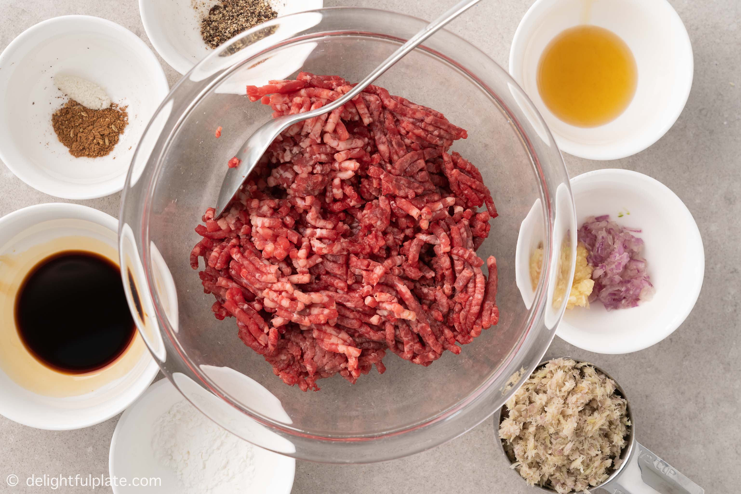 bowls containing ingredients for the beef filling