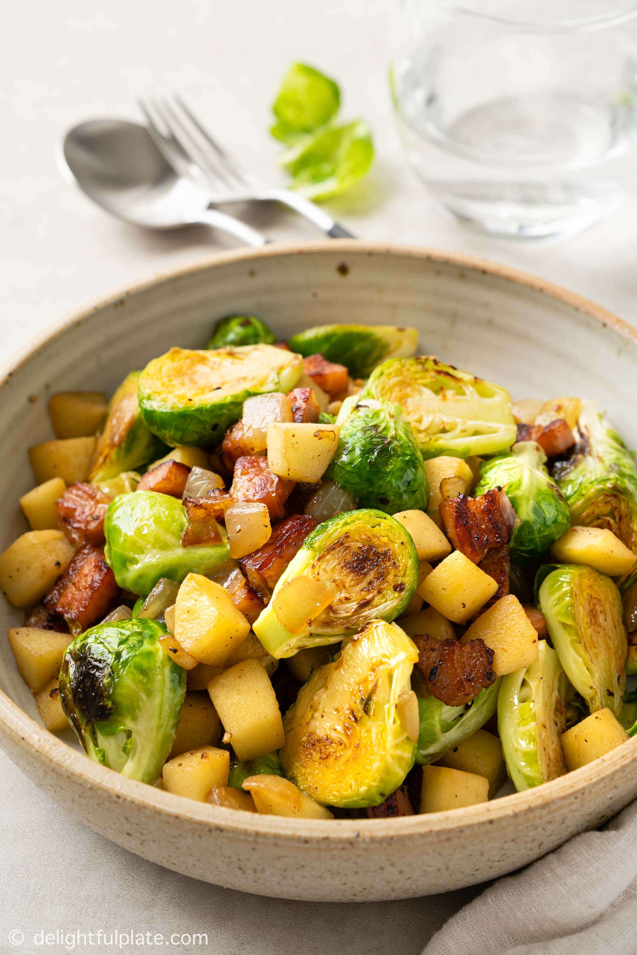 a bowl of Sautéed Brussels Sprouts with Bacon and Apple