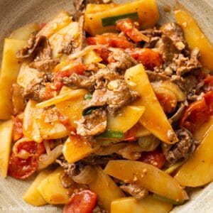 a plate of stir-fried beef and potato