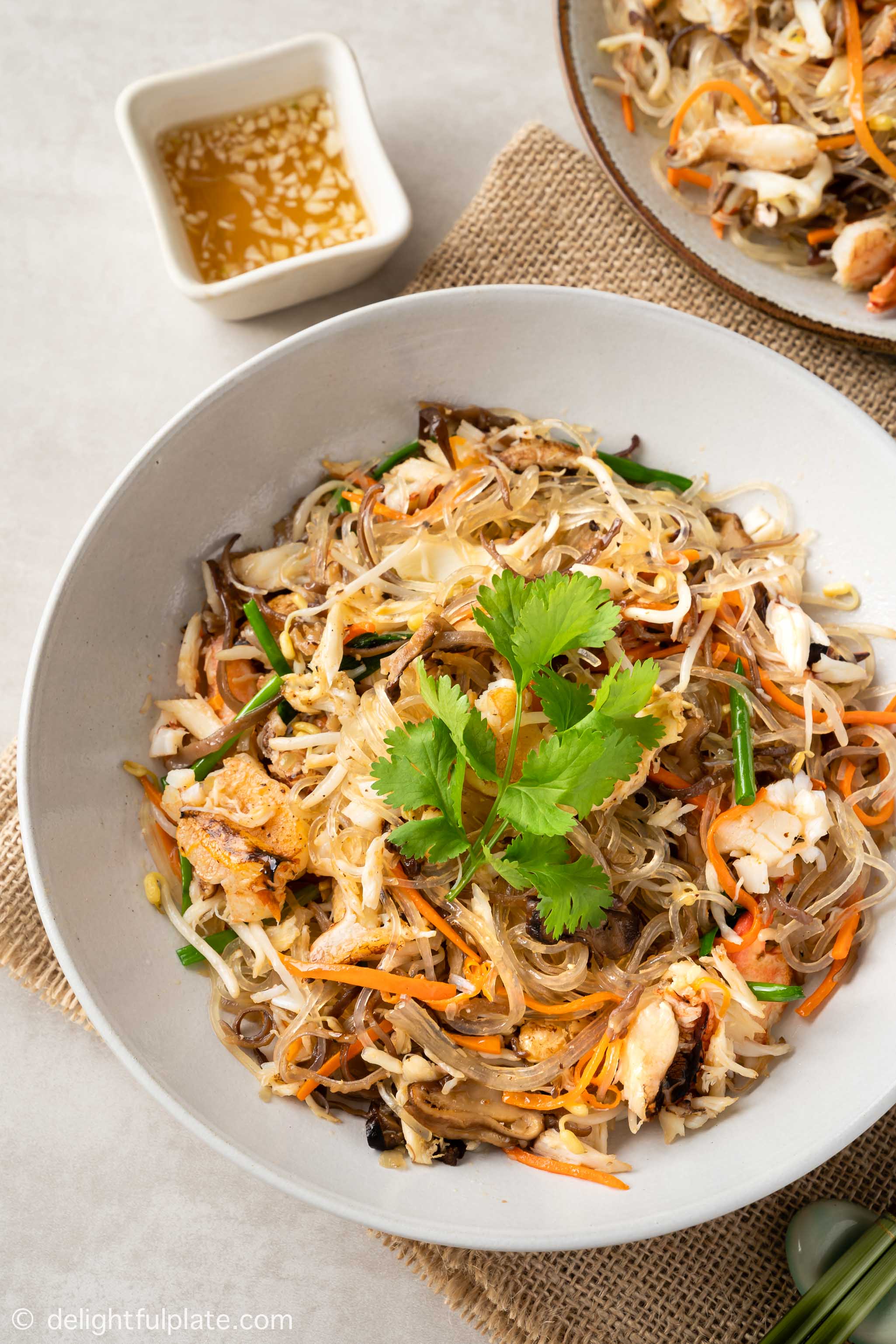 a plate of Vietnamese crab glass noodles stir-fry (mien xao cua)