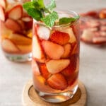 a glass of strawberry iced tea