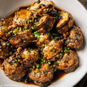 a plate of stuffed eggplant in black bean sauce