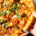 a slice of paprika chicken pizza