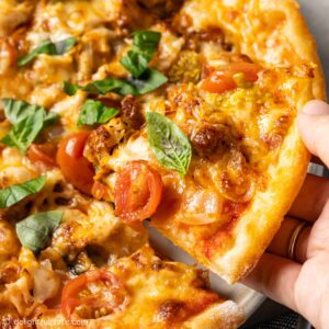 a slice of paprika chicken pizza