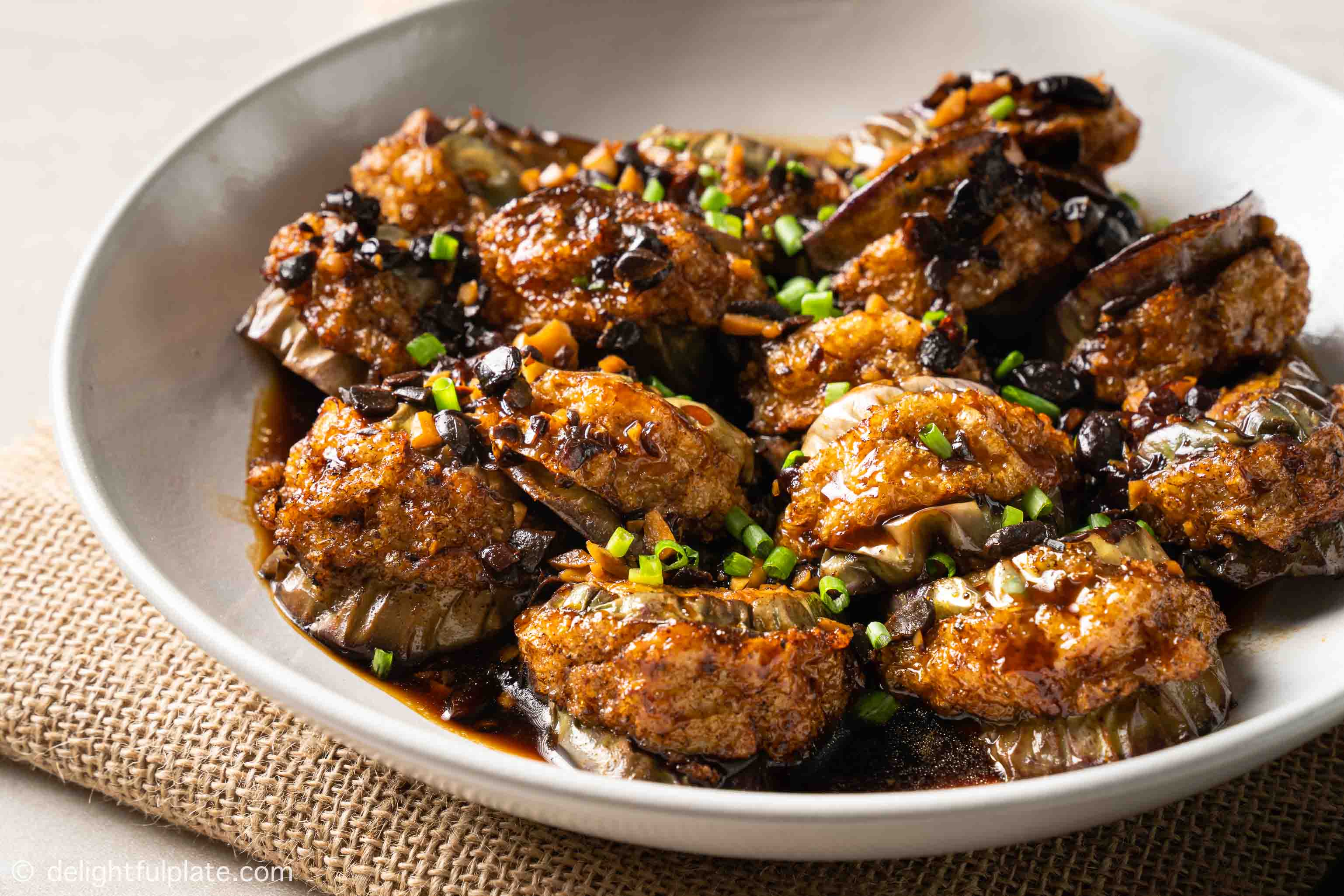 a plate of stuffed eggplant with black bean sauce