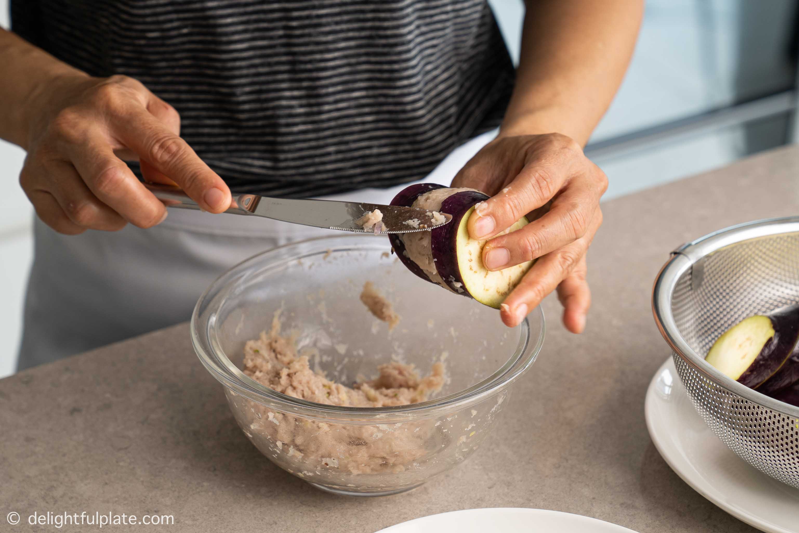 Stuffing eggplant with fish paste