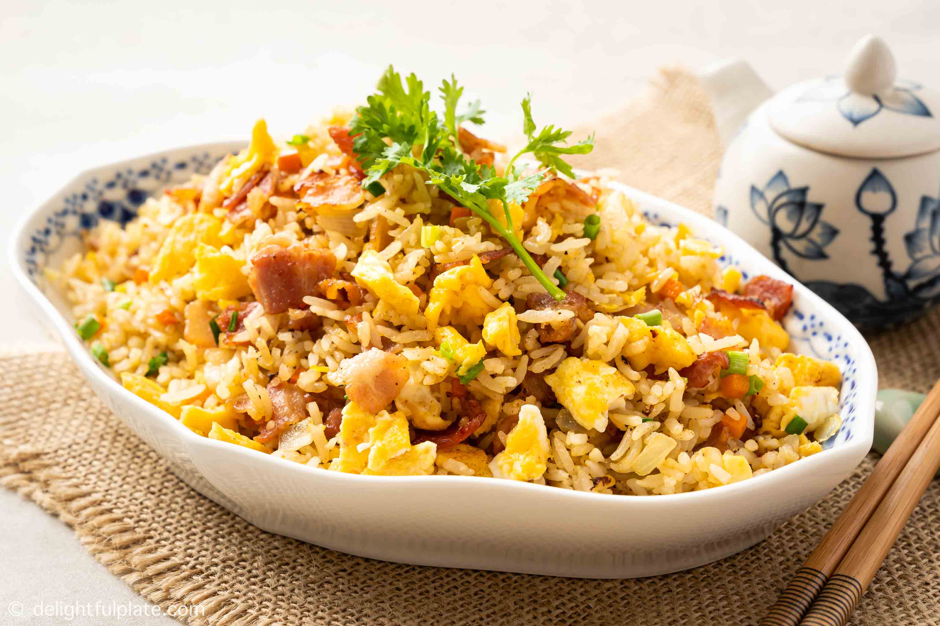 a plate of bacon fried rice