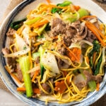 a plate of mi xao bo (beef noodle stir fry)