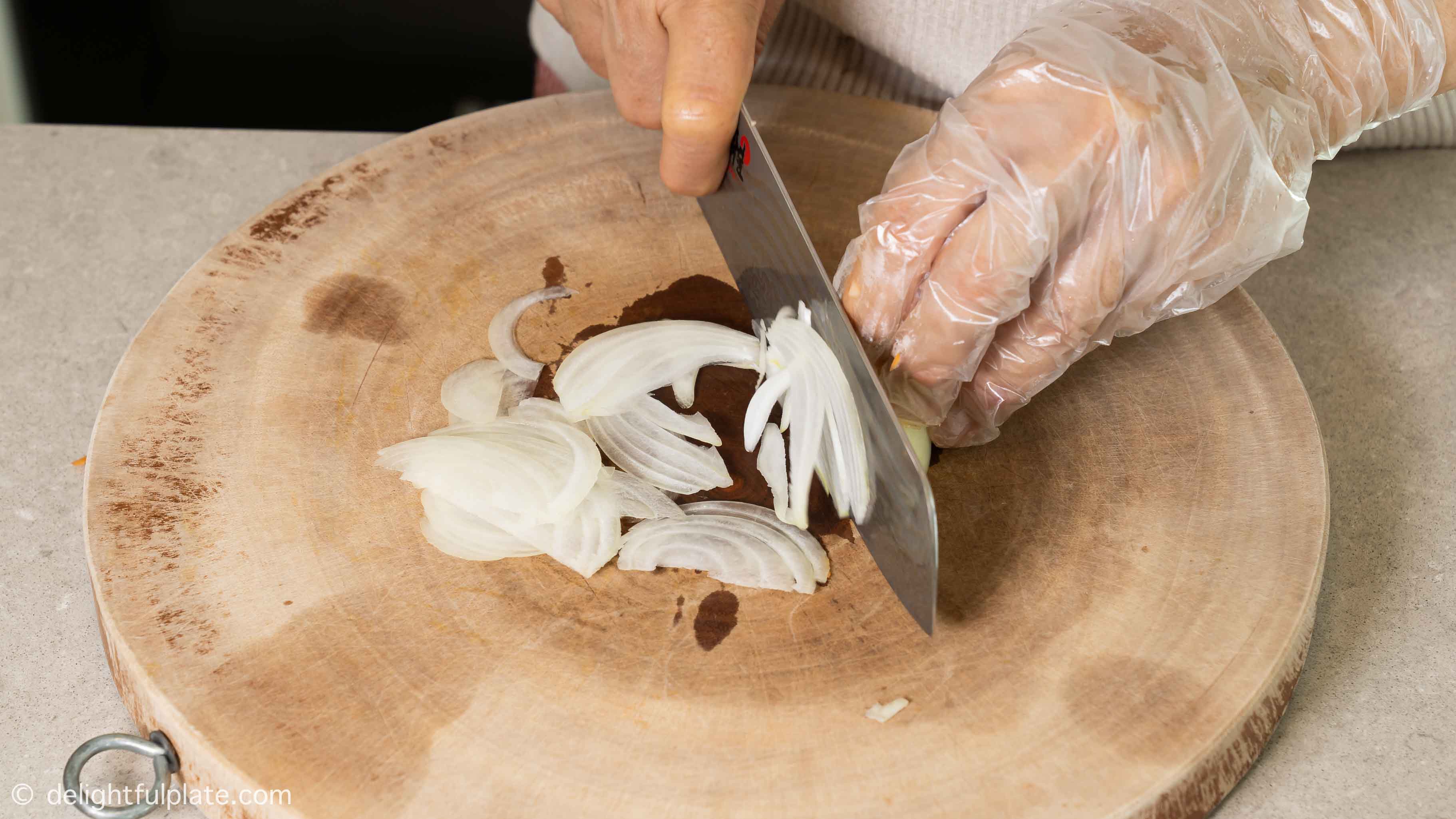 Julienne onion on a cutting board