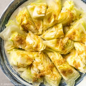 a plate of iceberg salad with ginger dressing