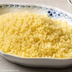 a plate of Vietnamese mung bean sticky rice (xoi vo)