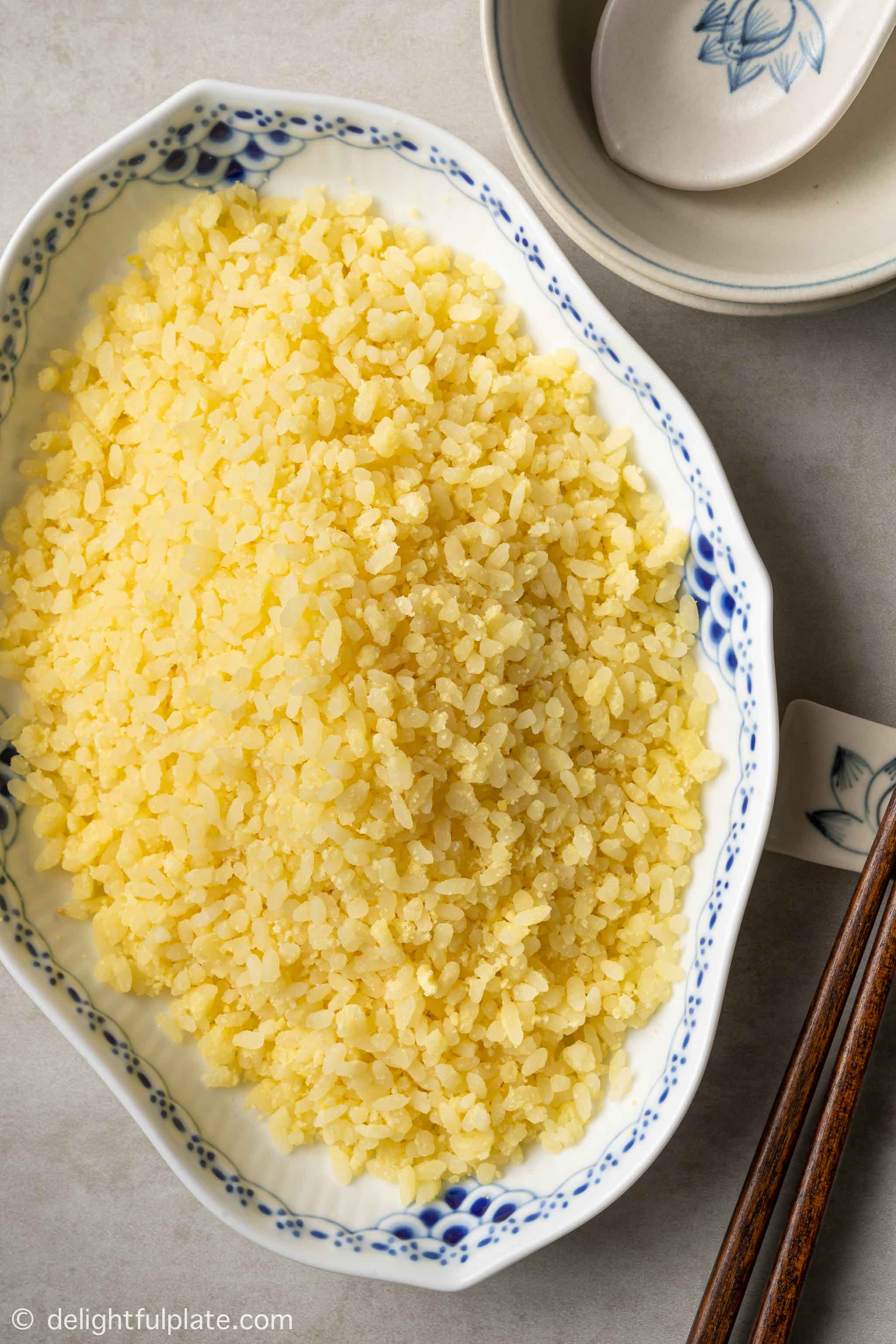 a plate of xoi vo (Vietnamese mung bean coated sticky rice)