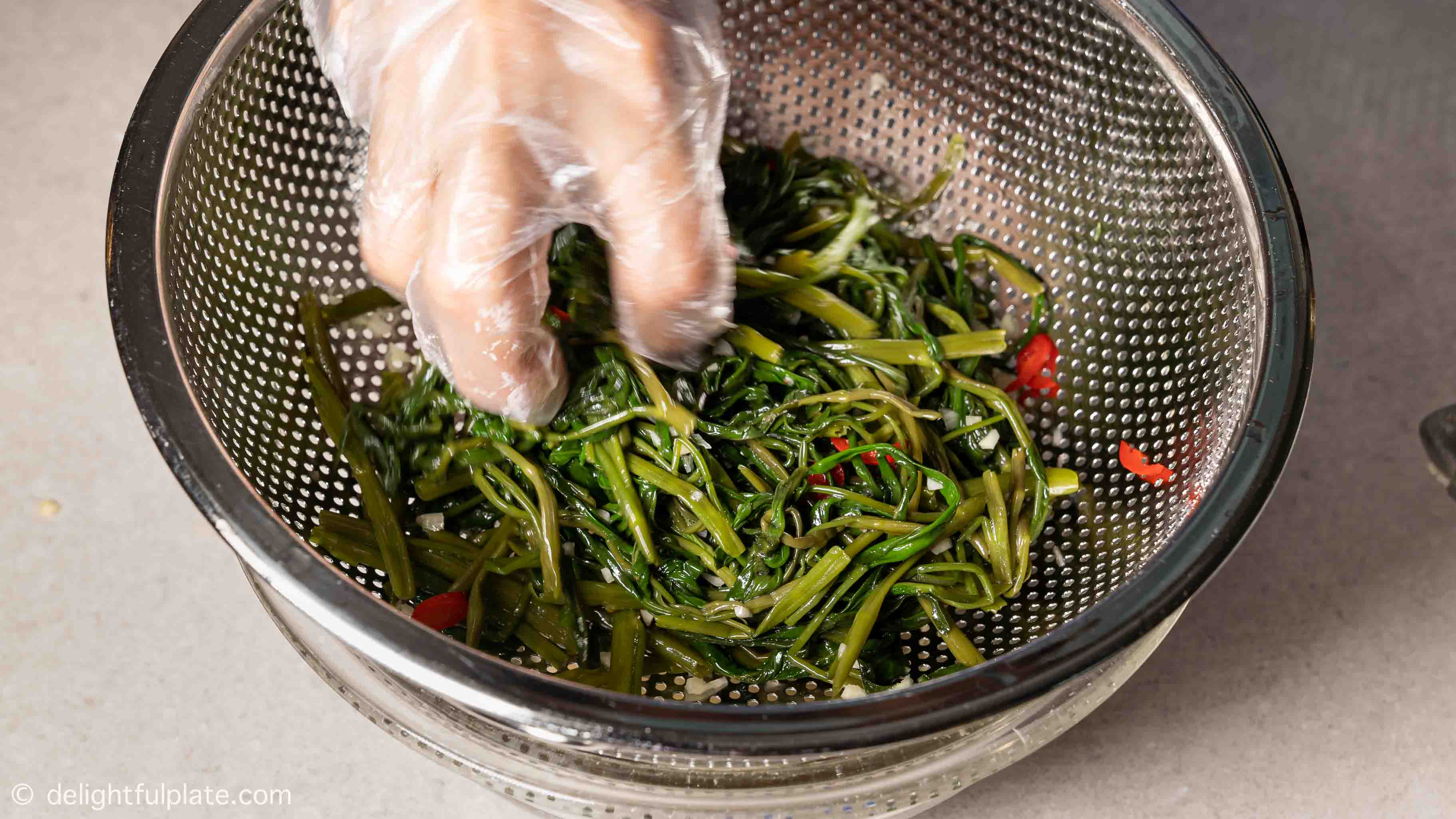 tossing the veggies with seasonings