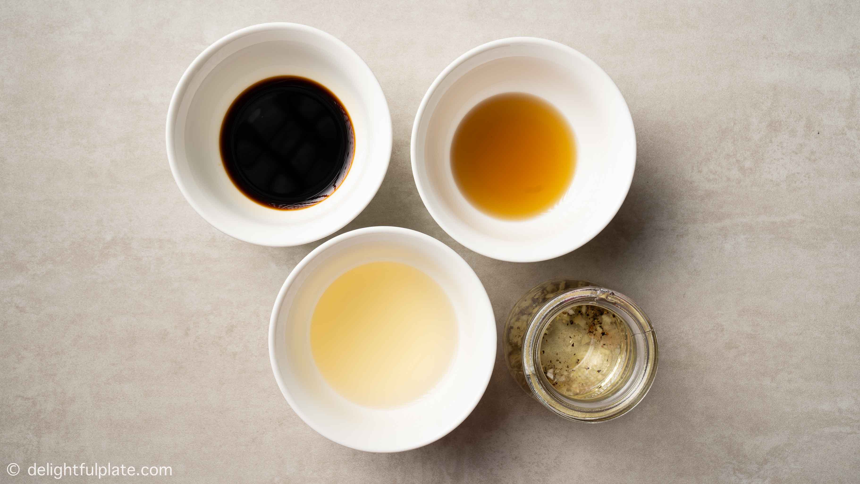 bowls containing ingredients for soy sauce dressing