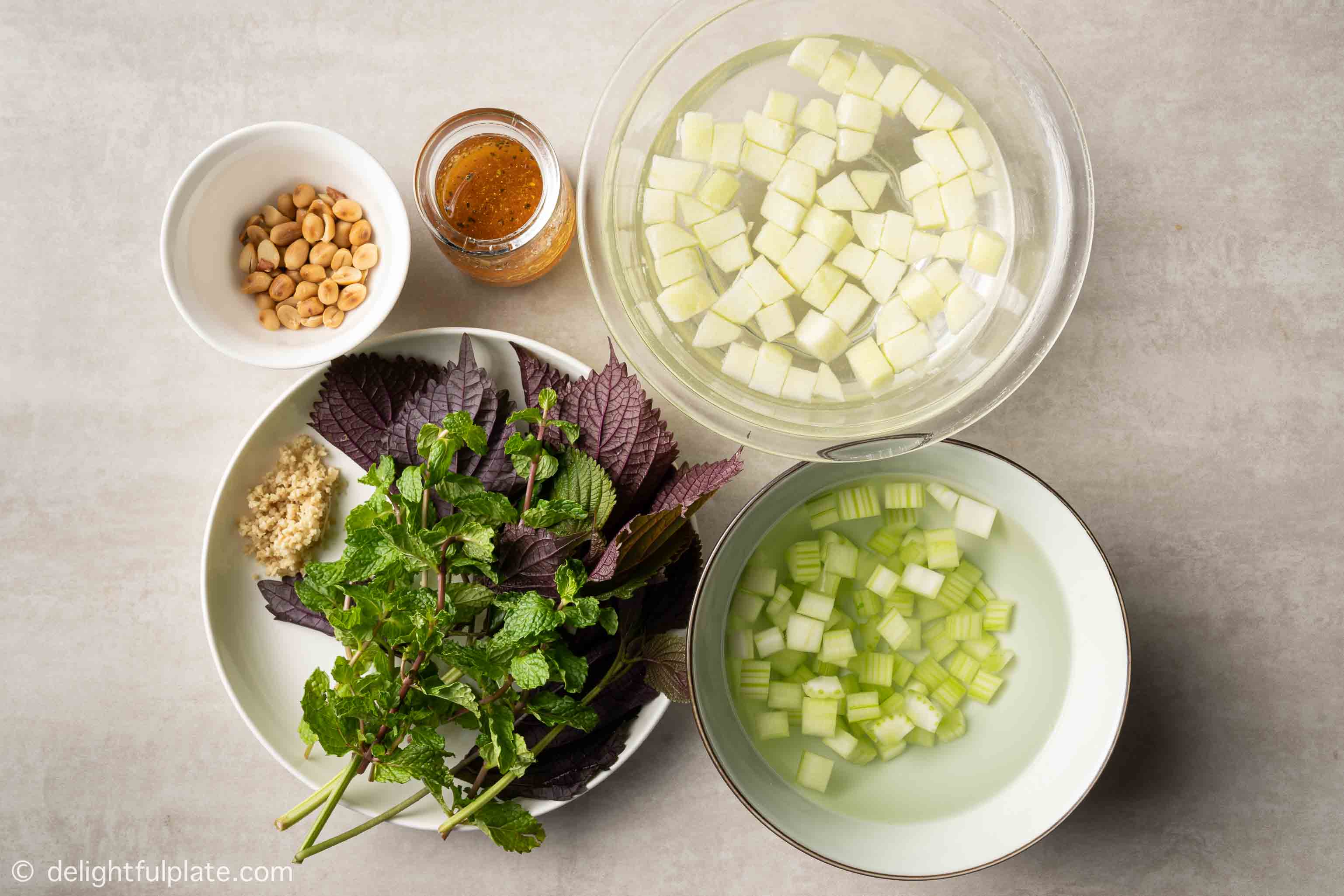 plates with ingredients for the grilled squid salad
