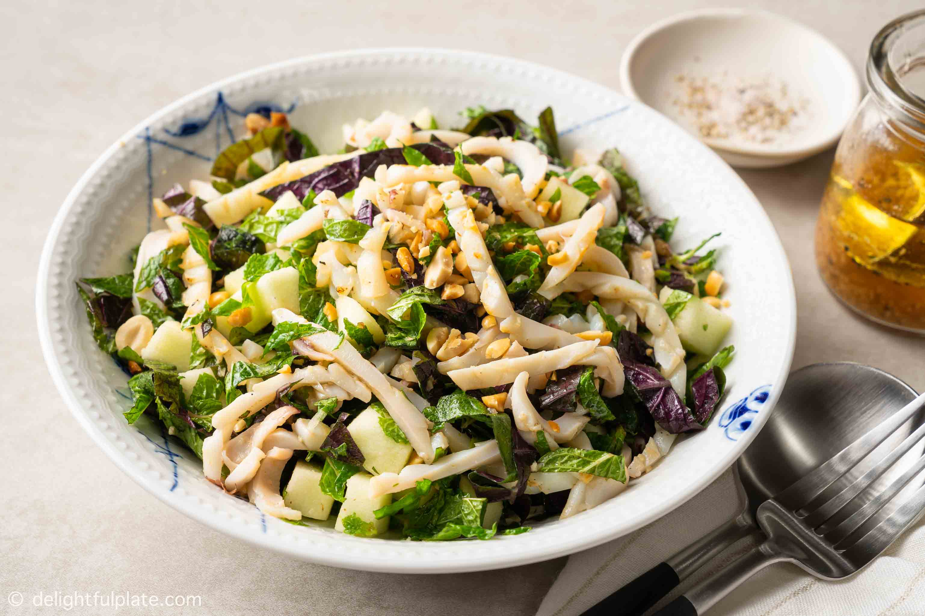 a plate of grilled calamari salad