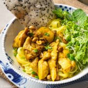 a bowl of mi Quang with chicken