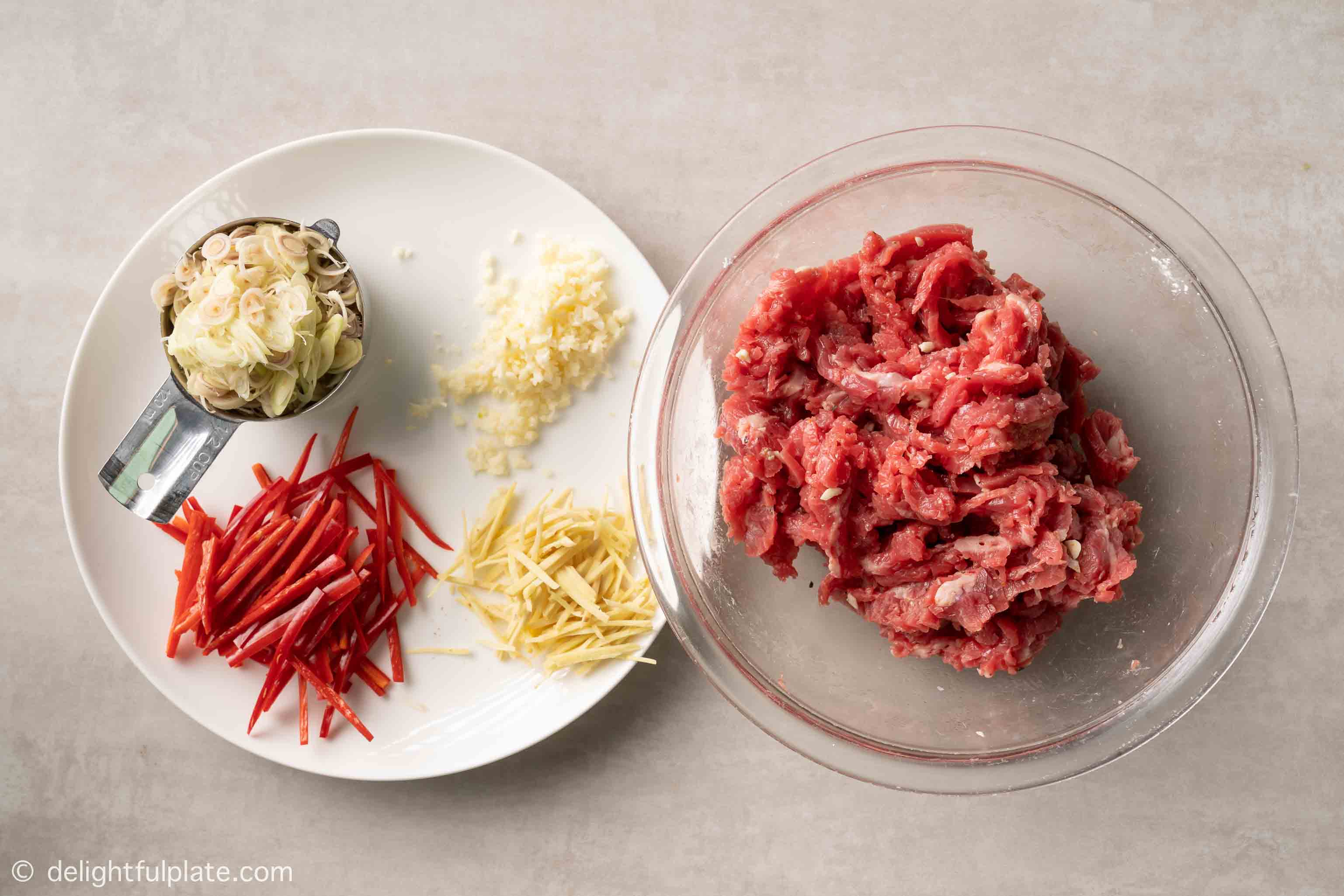 plates with prepped ingredients for the stir-fry