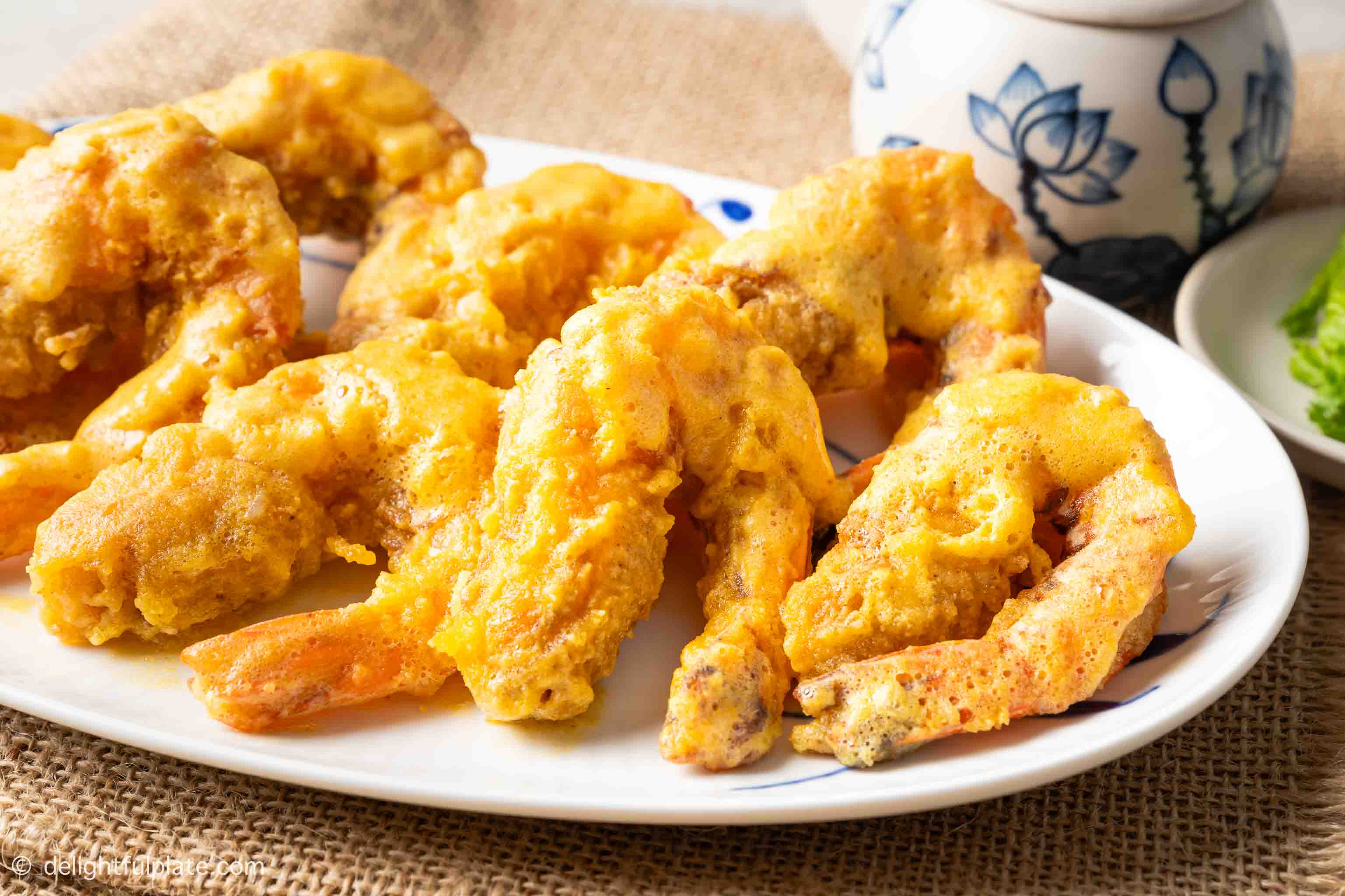 close up look of a plate of shrimp in salted egg yolk sauce.