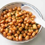 a bowl of homemade salted fried peanuts.